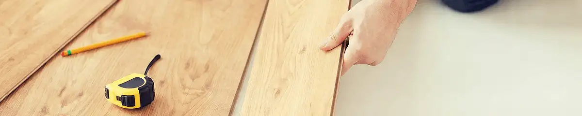 A professional installing wood flooring in Newark, NJ
