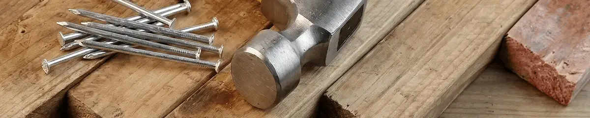 Hammer and nails on hardwood flooring boards in Newark, NJ
