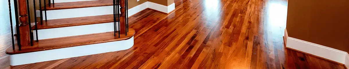 Base floor of a staircase with professionally restored wood flooring in Newark NJ