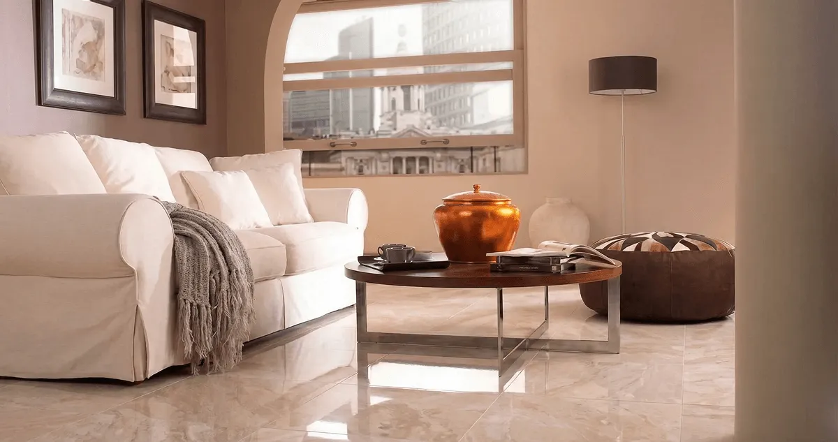 Modern living room with professionally installed marble flooring, a beige sofa, coffee table in Newark, NJ