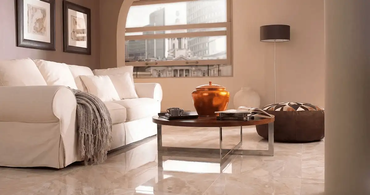 Modern living room with professionally installed marble flooring, a beige sofa, coffee table in Newark, NJ