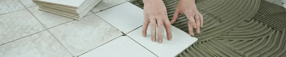 Professional installing white tile floors in Newark, NJ