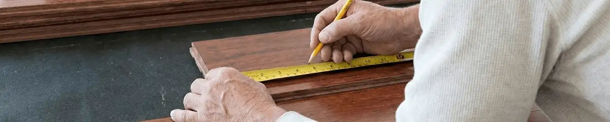 A professional installing wood flooring in Newark, NJ